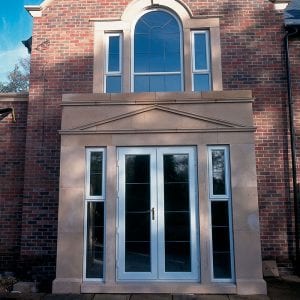 White french doors set within masonry