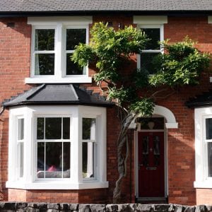 White sash windows in a red brick house